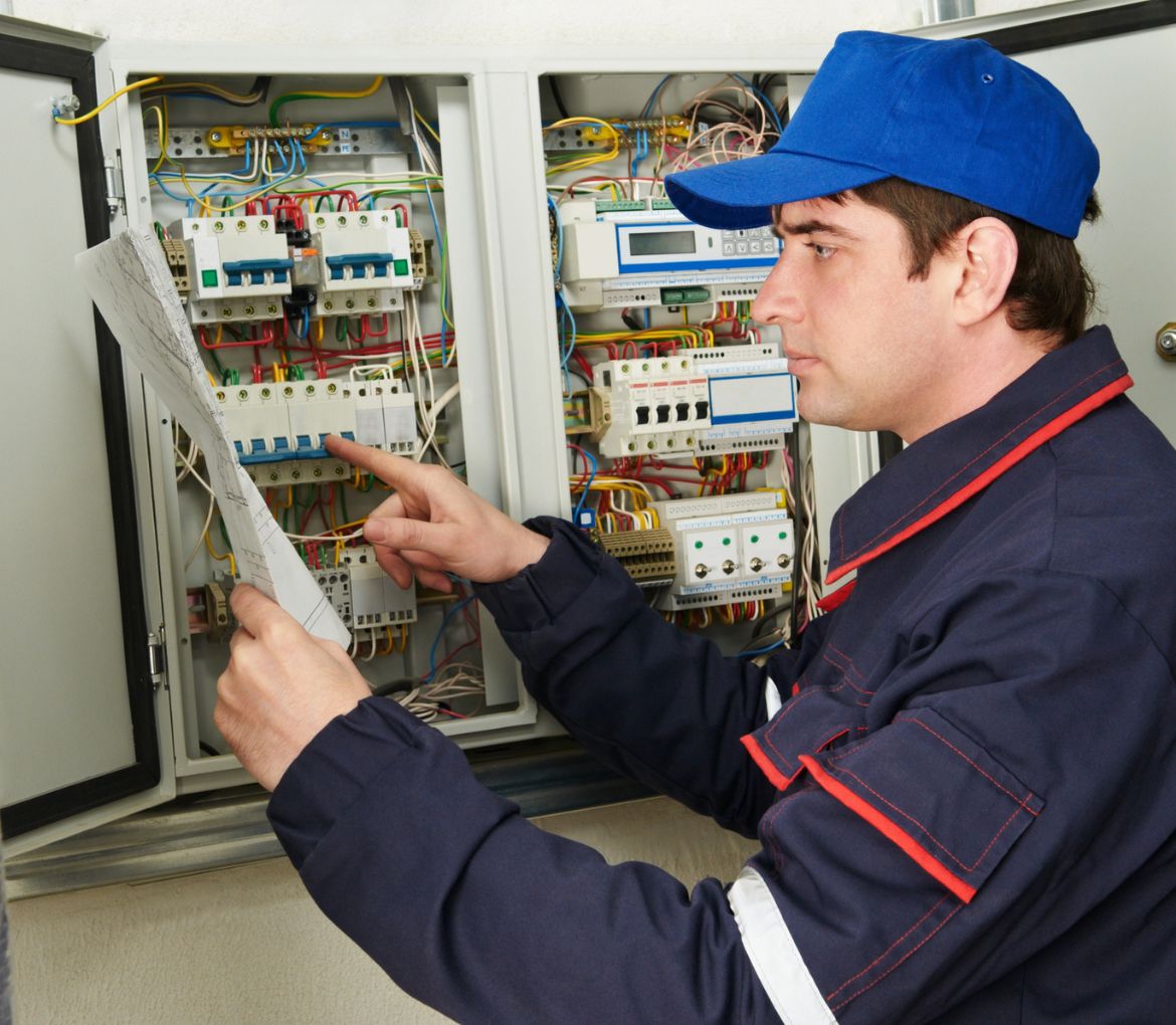 Technician in Jupiter, FL performing an electrical panel inspection