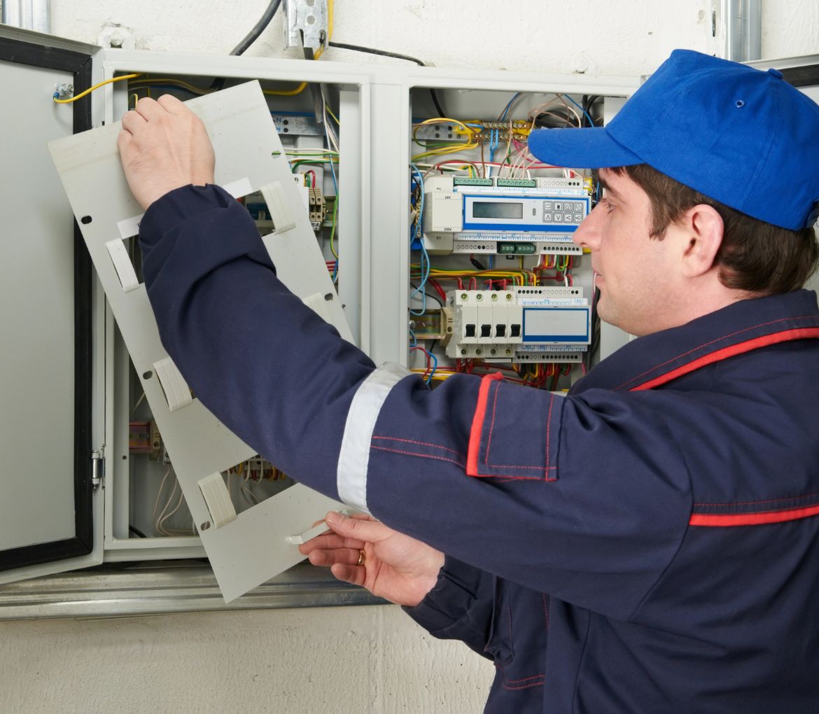 Technician in Wellington, FL performing a panel inspection